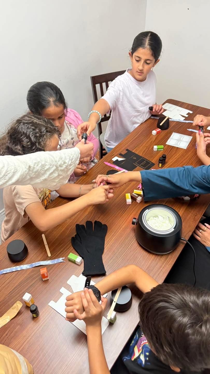 Young people making crafts together at a YCEC art program
